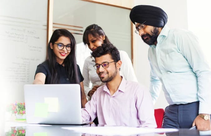 Indian Businessmen looking at laptop